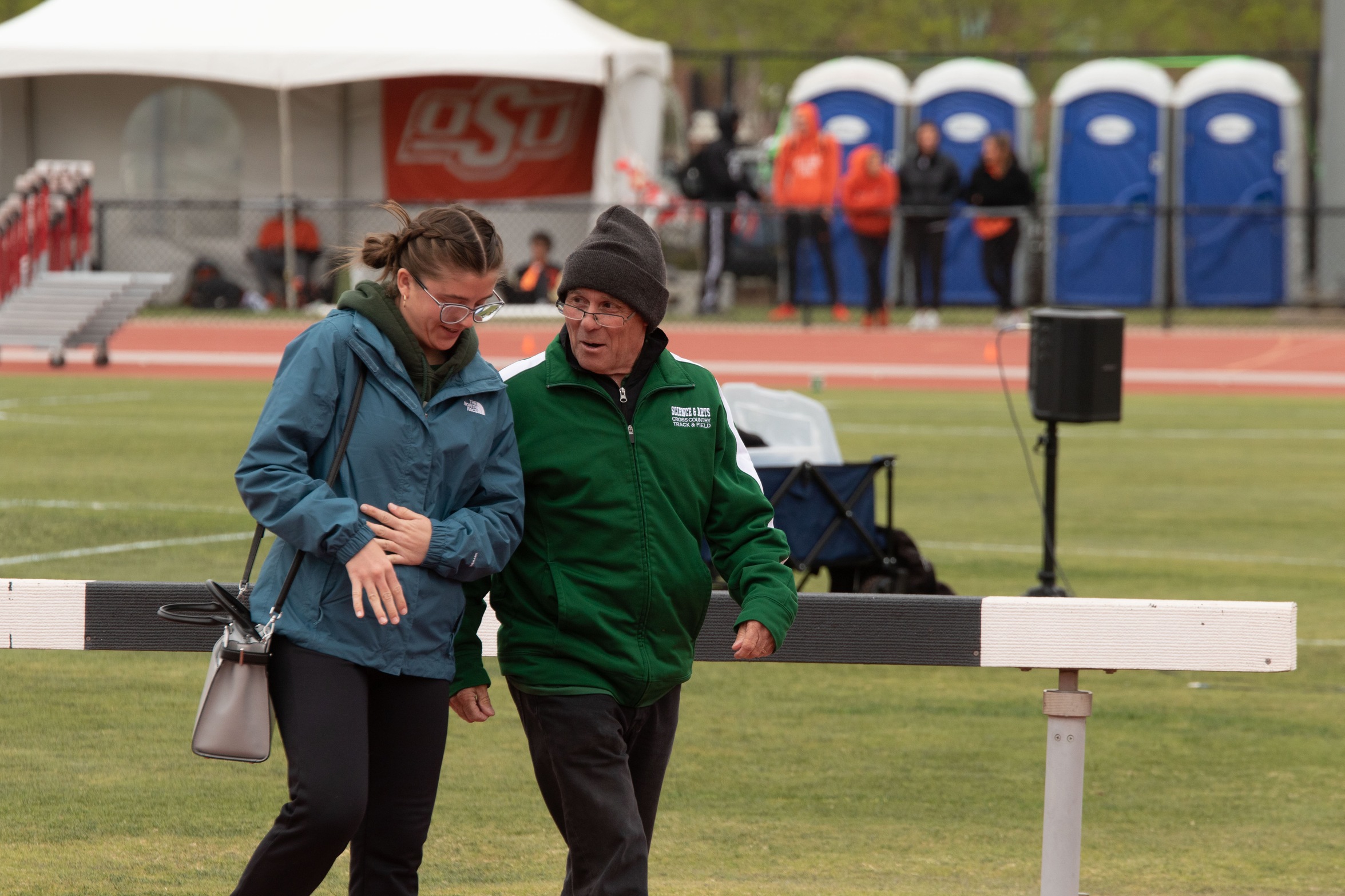 Coach Brian Worthington talking to one of his student-athletes before a race.